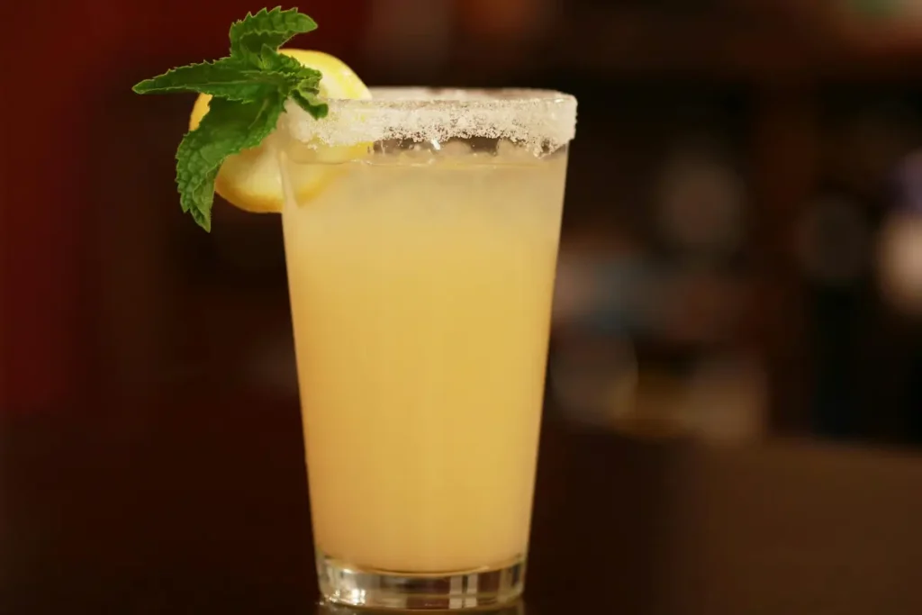 Refreshing with Natural Mounjaro Recipe, this glass of lemon juice with ginger and honey, served with fresh lemon slices and ginger